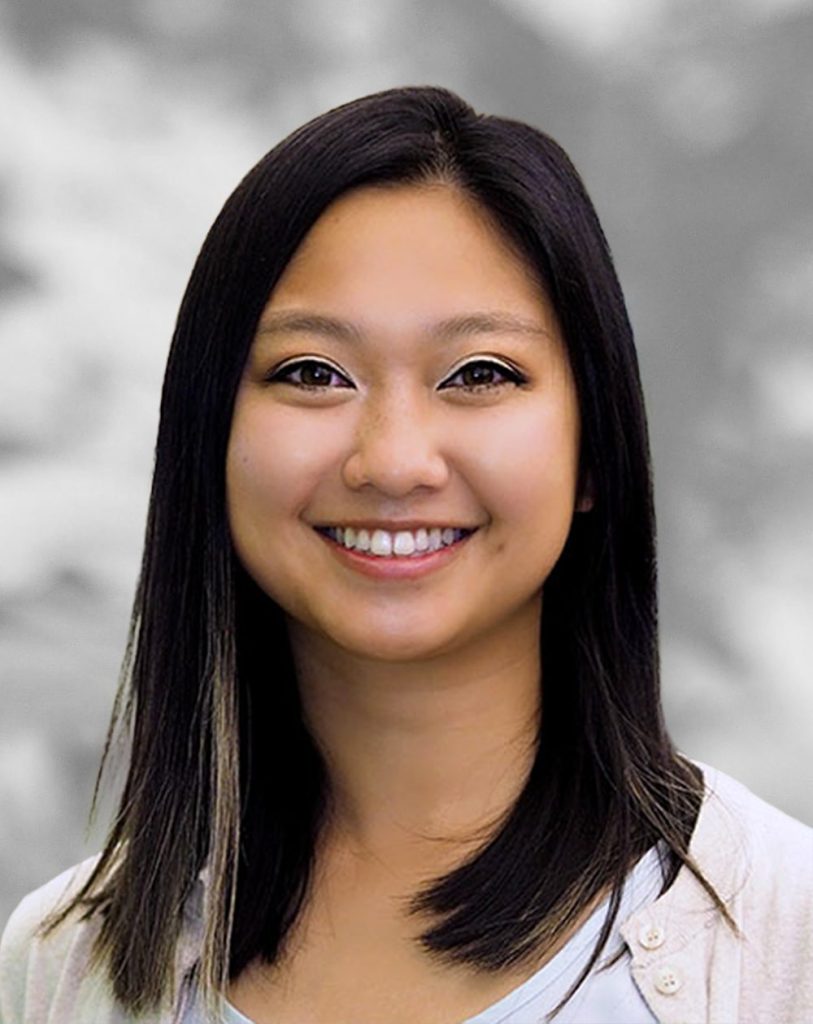 A portrait of Thu Nguyen, a smiling woman with shoulder-length dark hair against a blurred background.