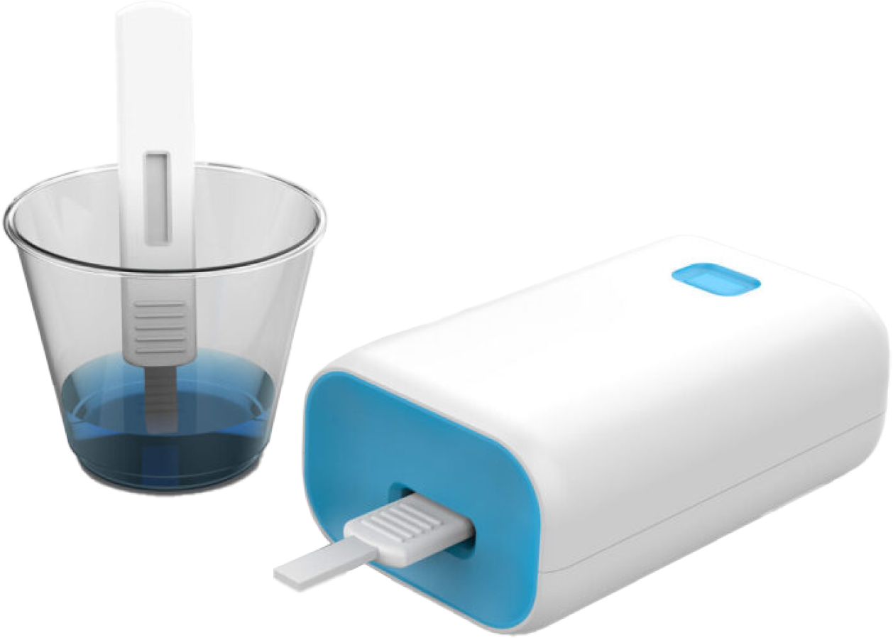 A glucose meter with a testing strip inserted and a container with a blue liquid solution beside it.